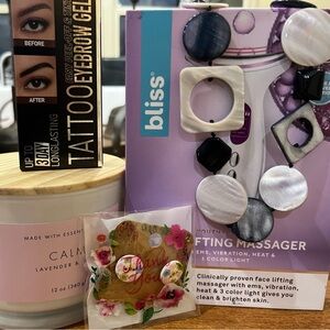 All NWT candle, eye brow dye, face massager, necklace, floral earrings.